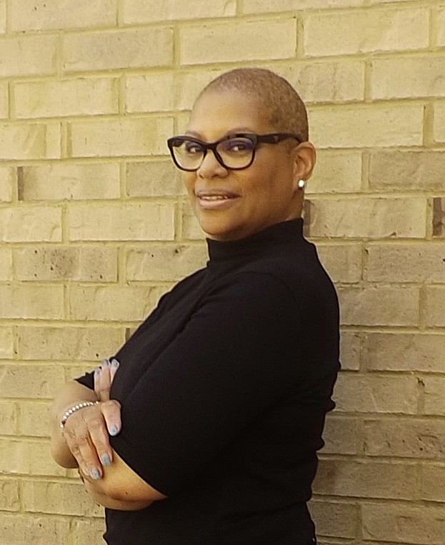 Sonya Patton smiling in a black outfit